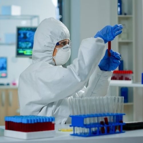researcher-coverall-holding-test